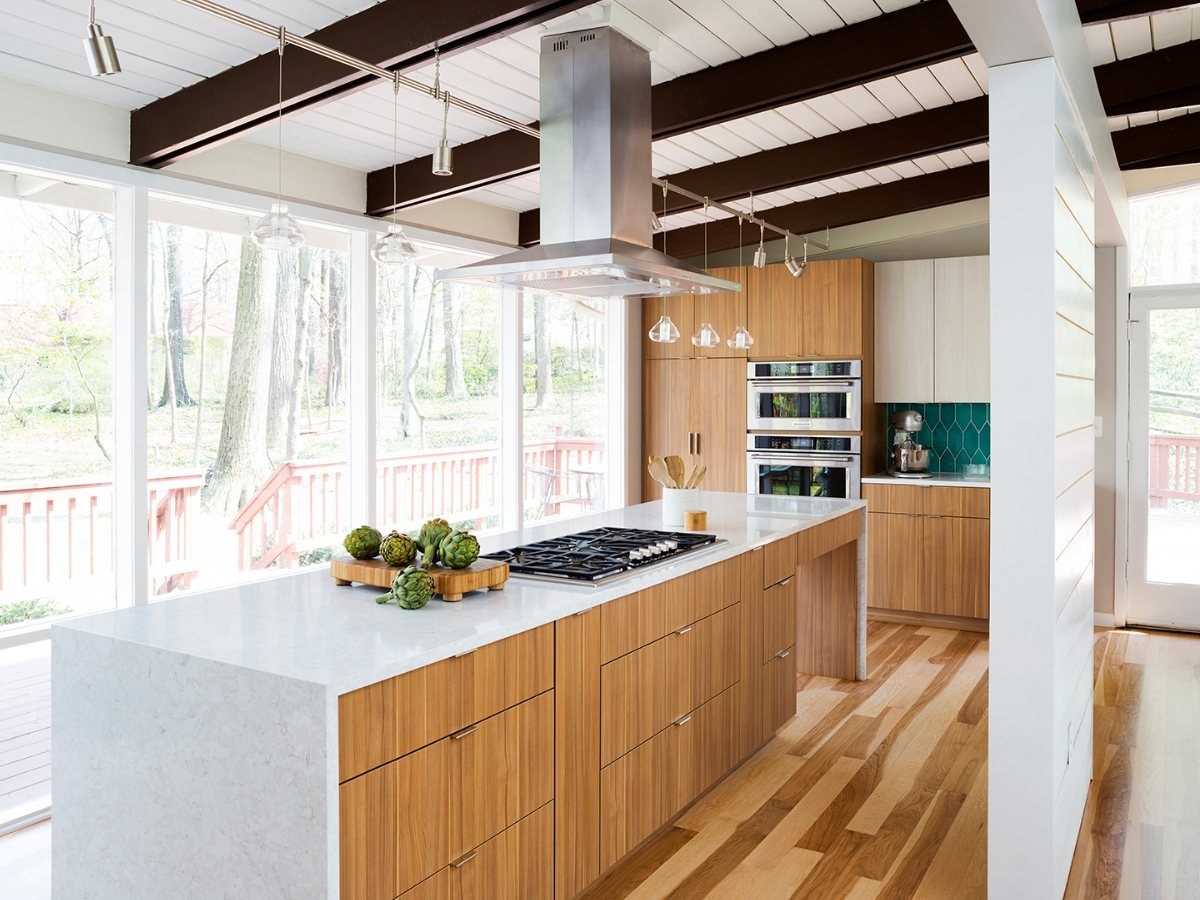 Eclipse Metropolitan frameless kitchen in Arizona Cypress textured TFL with a quartz waterfall island — manufacturer photo
