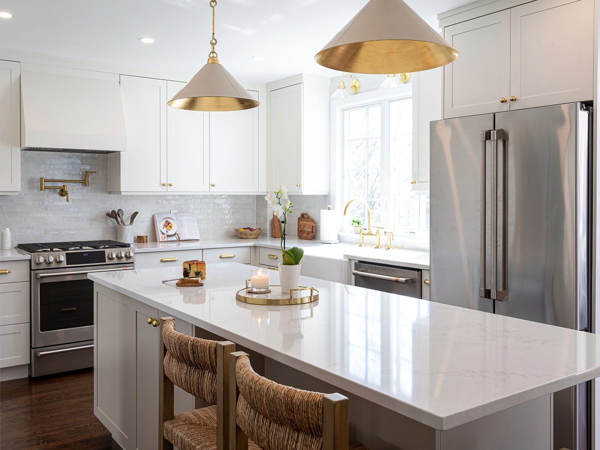 Crystal Cabinet Works Modesto door in Alabaster with brass pendants — manufacturer photo