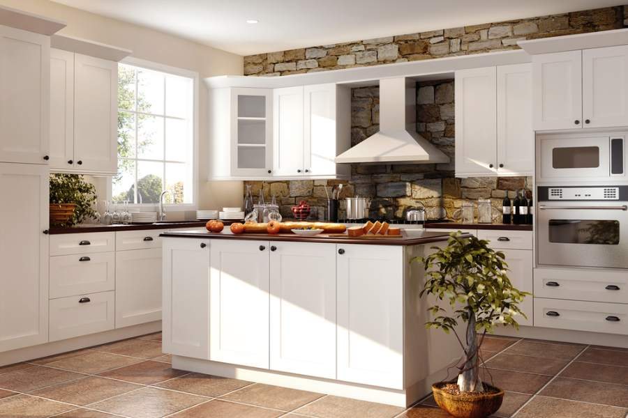 Adornus Hampton door in High Reflective White with a stone accent wall — manufacturer photo