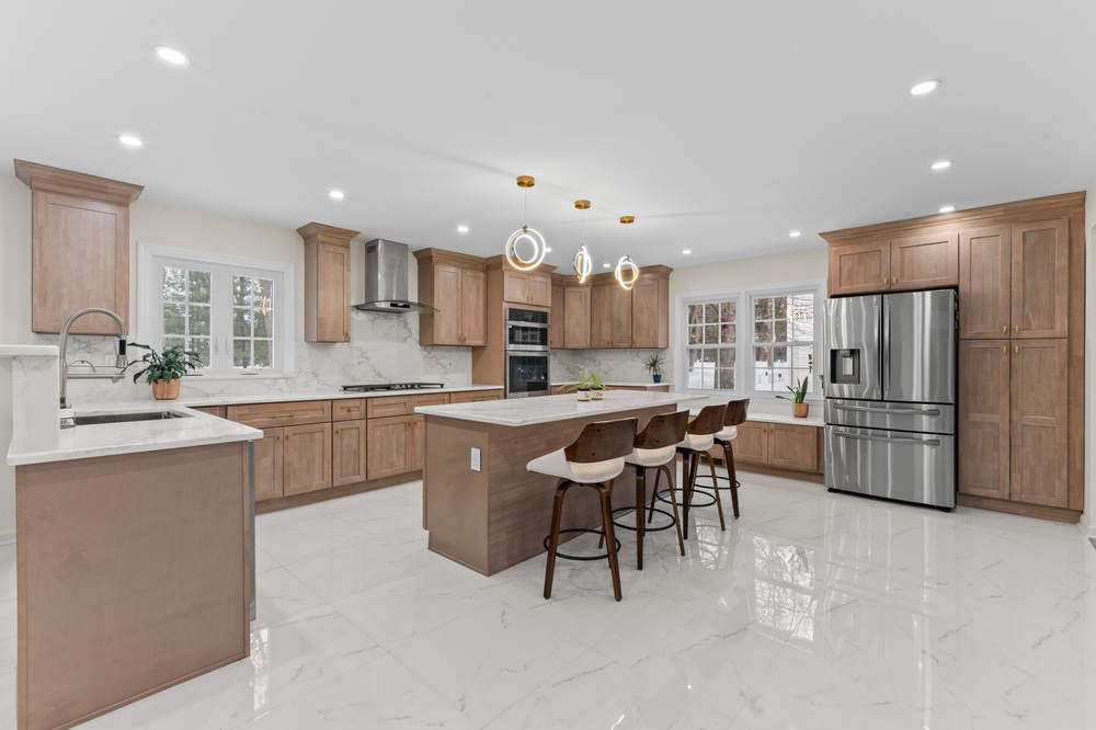 FGM warm wood kitchen with a quartz island — manufacturer photo