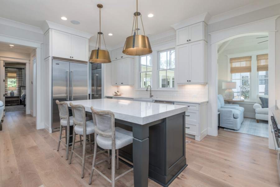 Cottage maple door in Alabaster with an Iron island — Kith Kitchens photo
