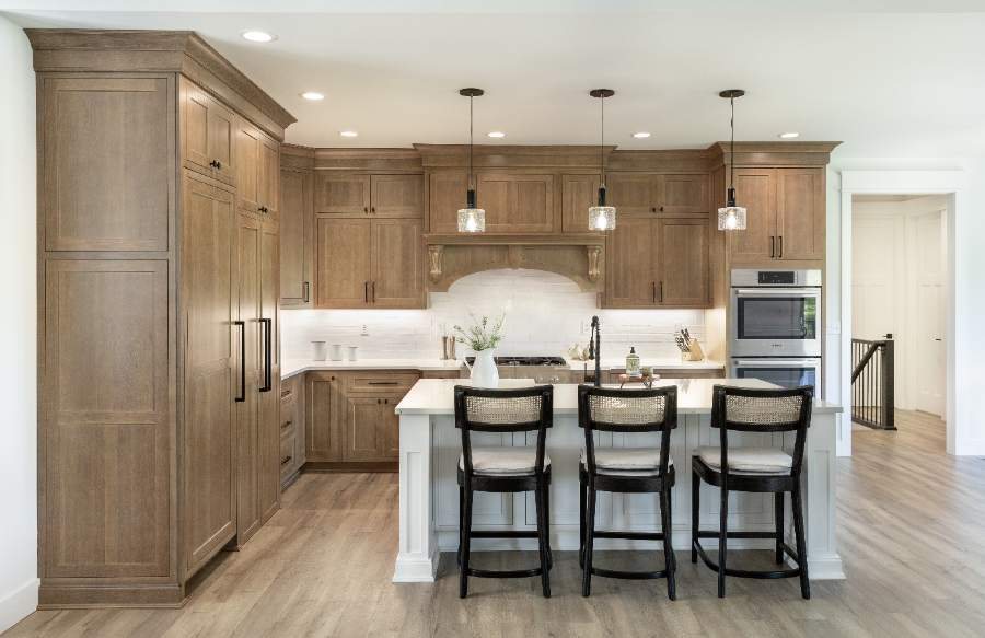 Almond on rift-cut white oak, flush inset Hanover door; Arctic island — Shiloh photo