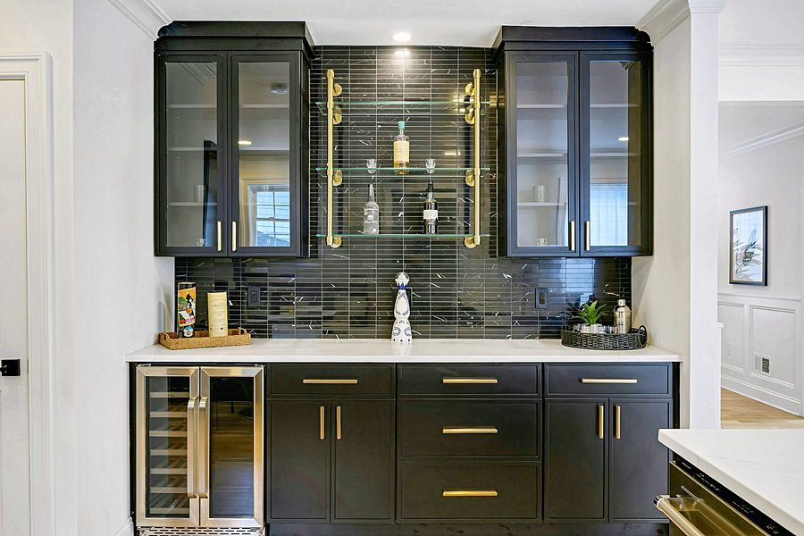 Black and natural oak kitchen with a green bath