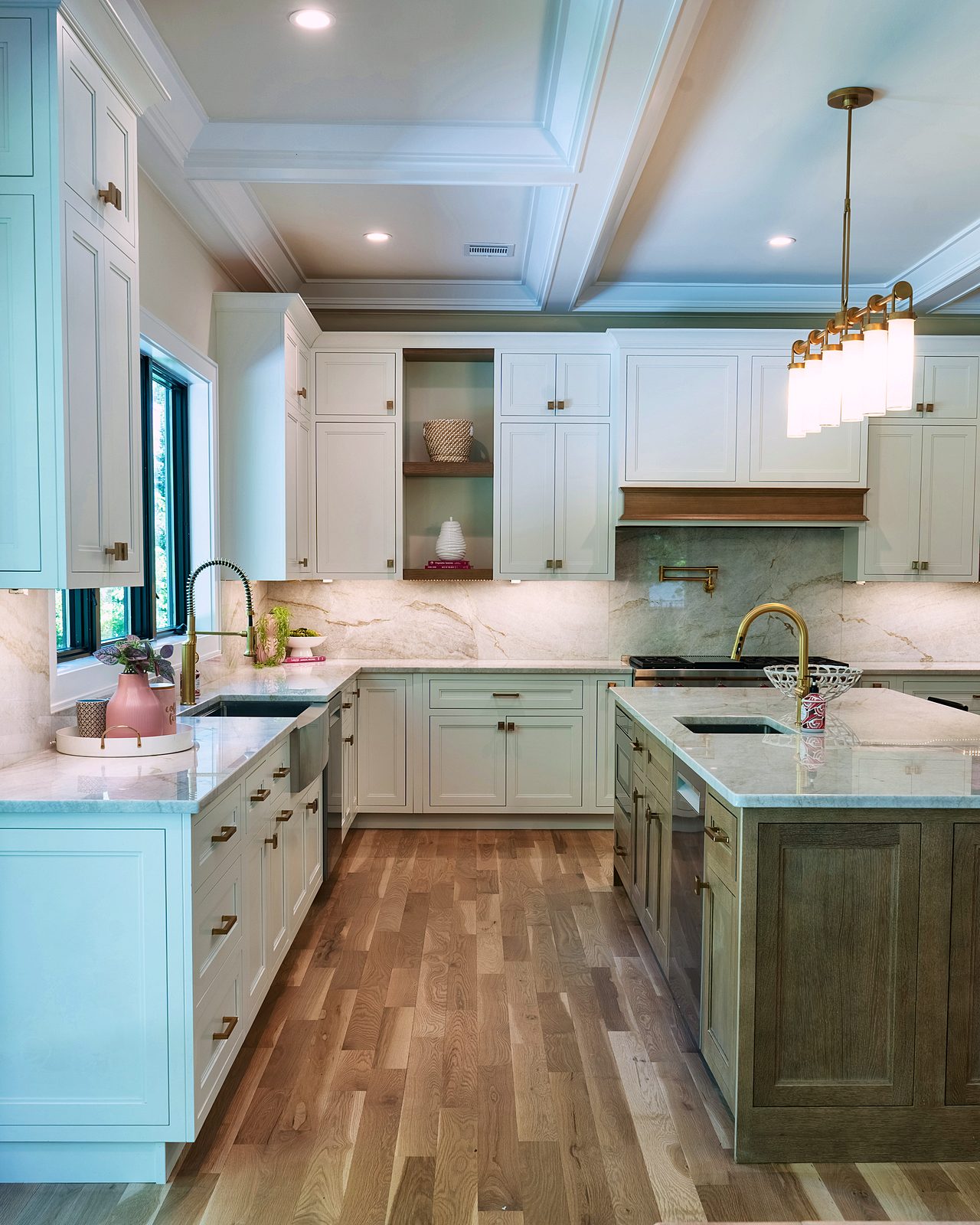 Range wall with quartzite backsplash and oak hood band