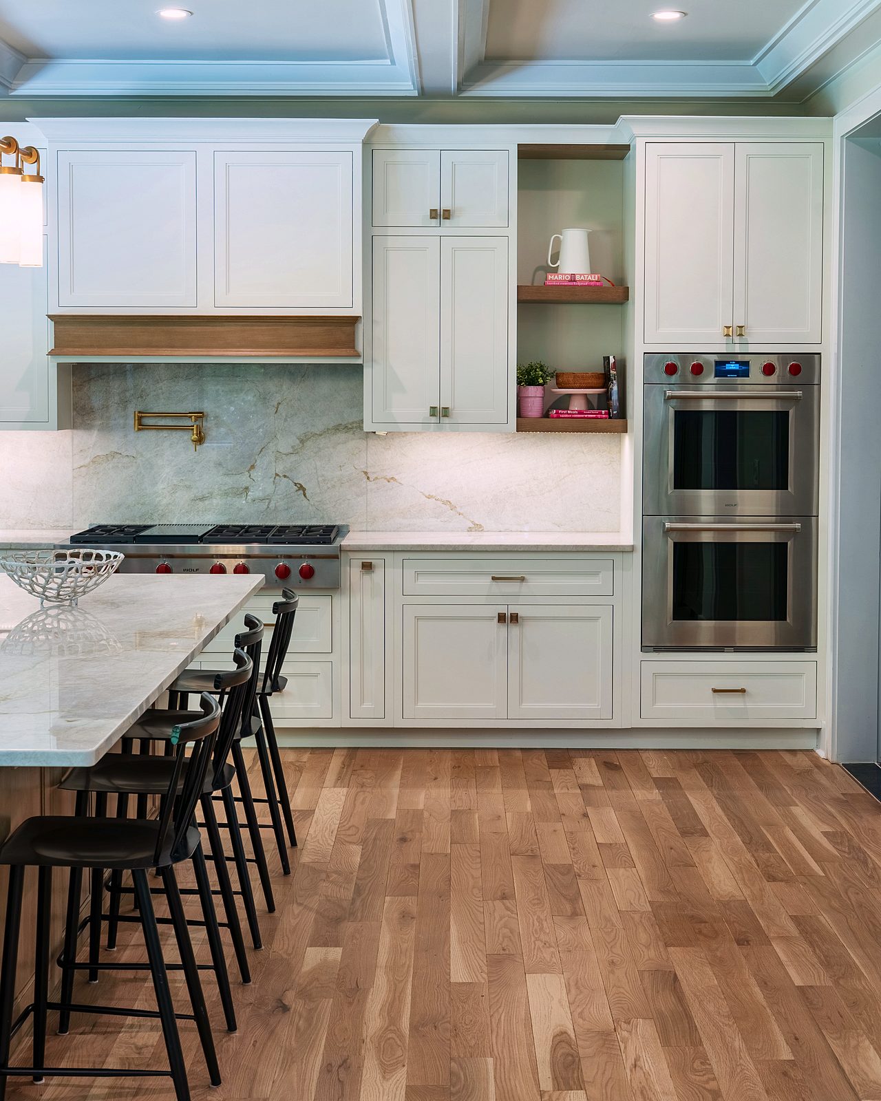 Double wall ovens and oak-framed shelves