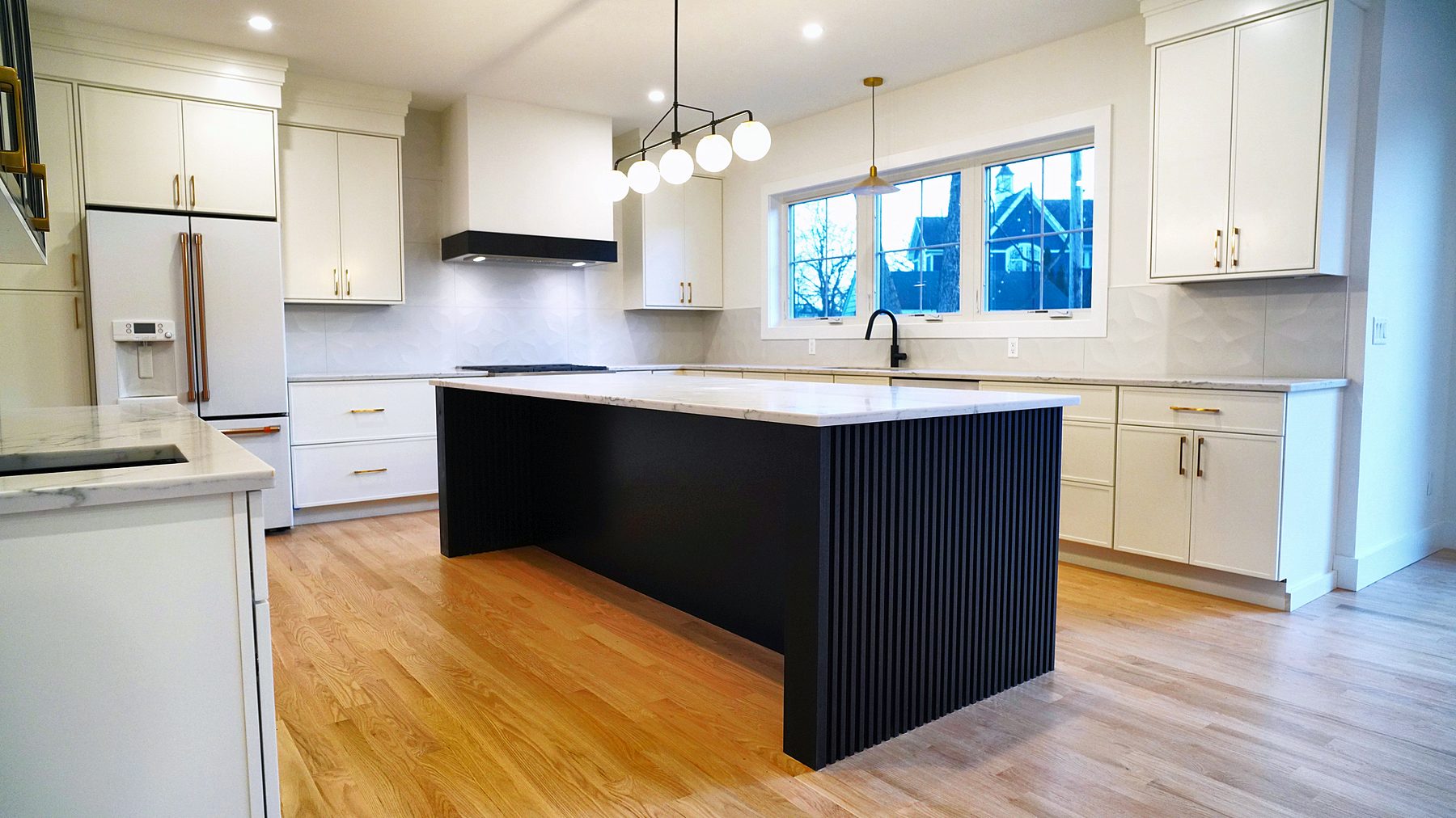 Fluted Pitch Black island in a Dove Luna kitchen