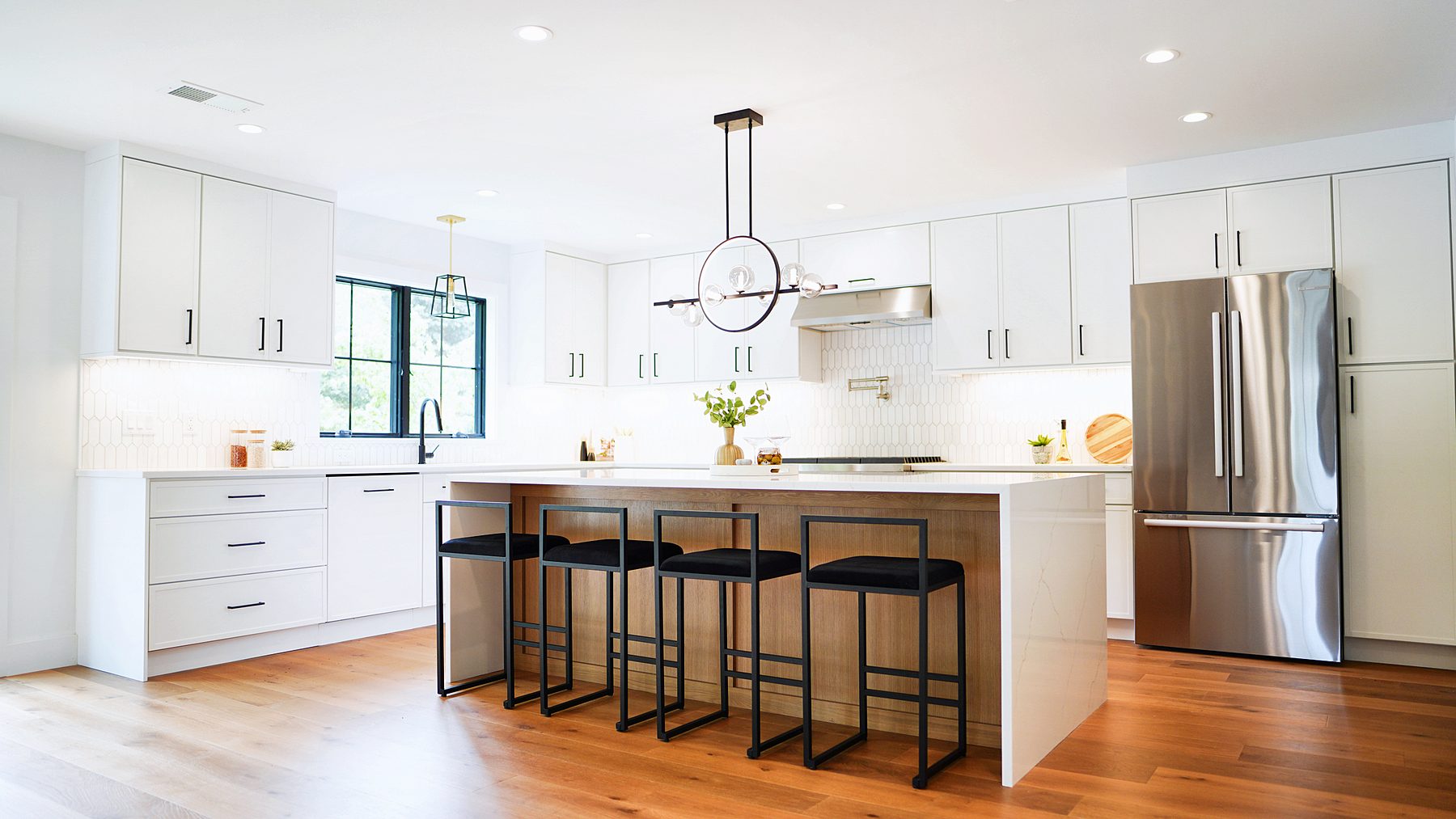 Petit White kitchen with Petit Oak island and waterfall quartz