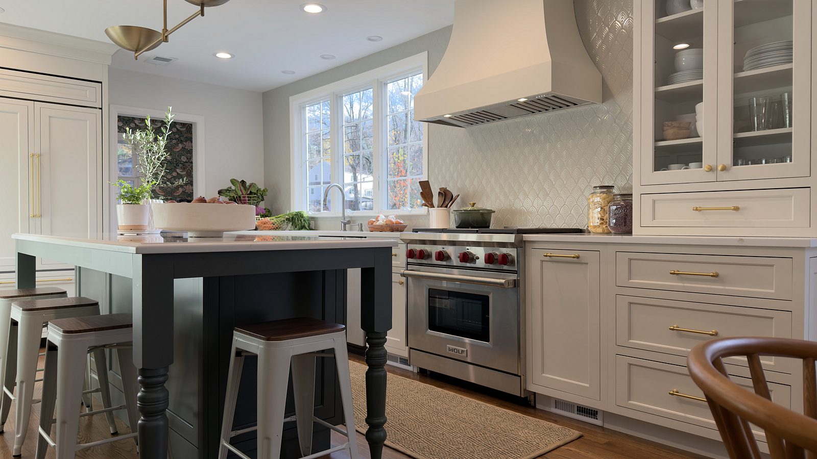 Island looking toward the range wall and the plaster-style hood