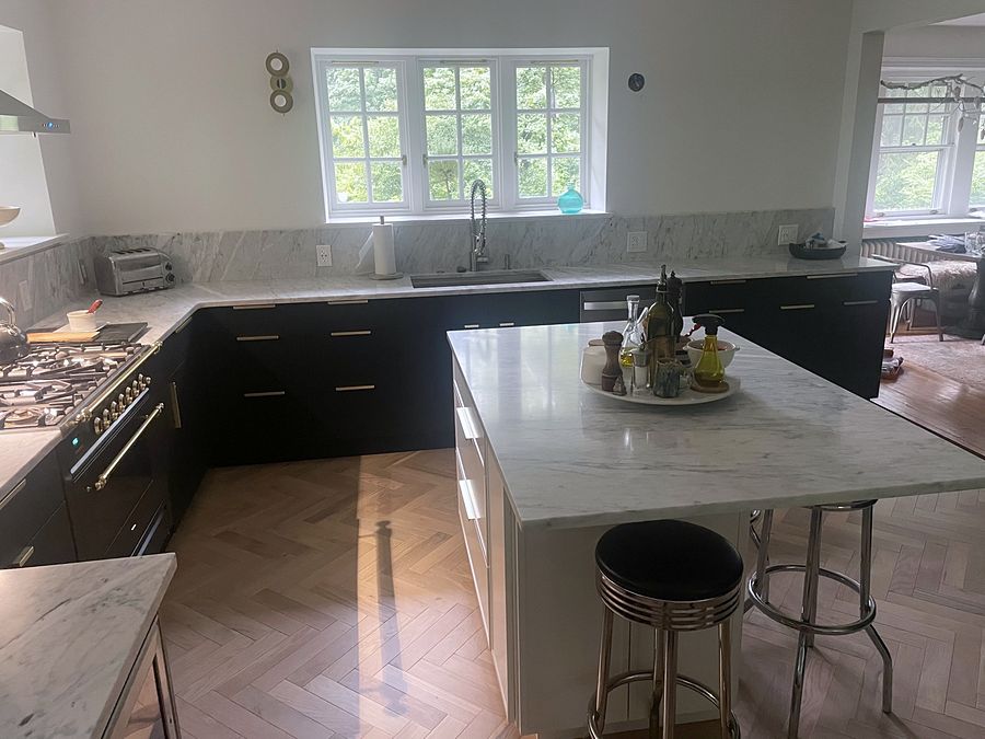 Fabuwood Luna kitchen in matte black with a Dove island and a herringbone floor