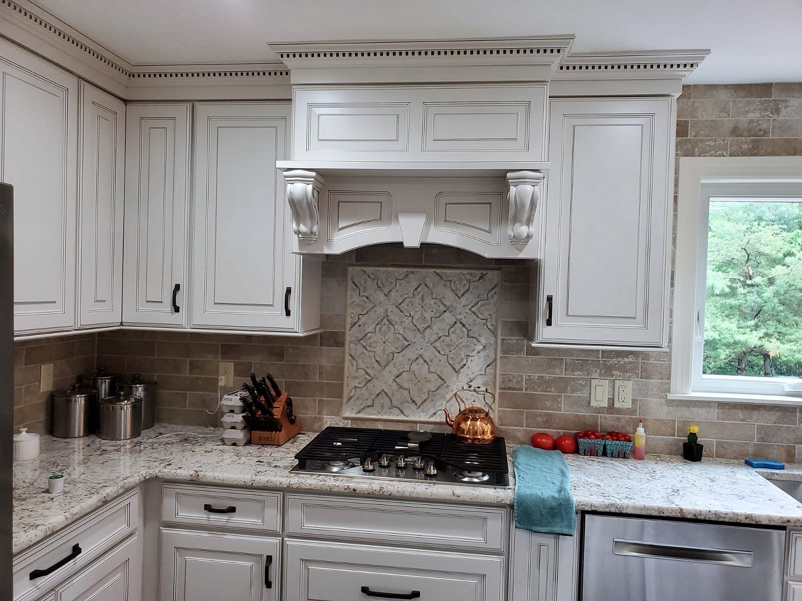 Kabinart Hampton raised-panel door, Polar (archive label) — Kabinart Hampton raised-panel kitchen in Polar with an arched hood and granite