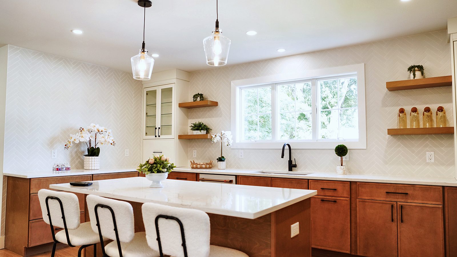 Island with Timber base and black stools