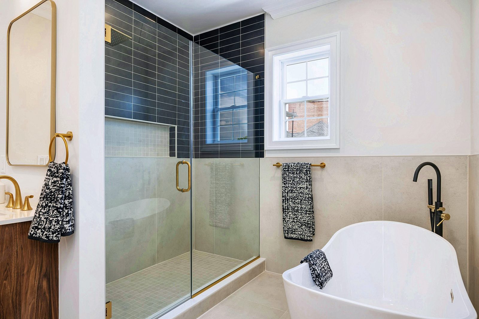 Freestanding tub beside the glass shower