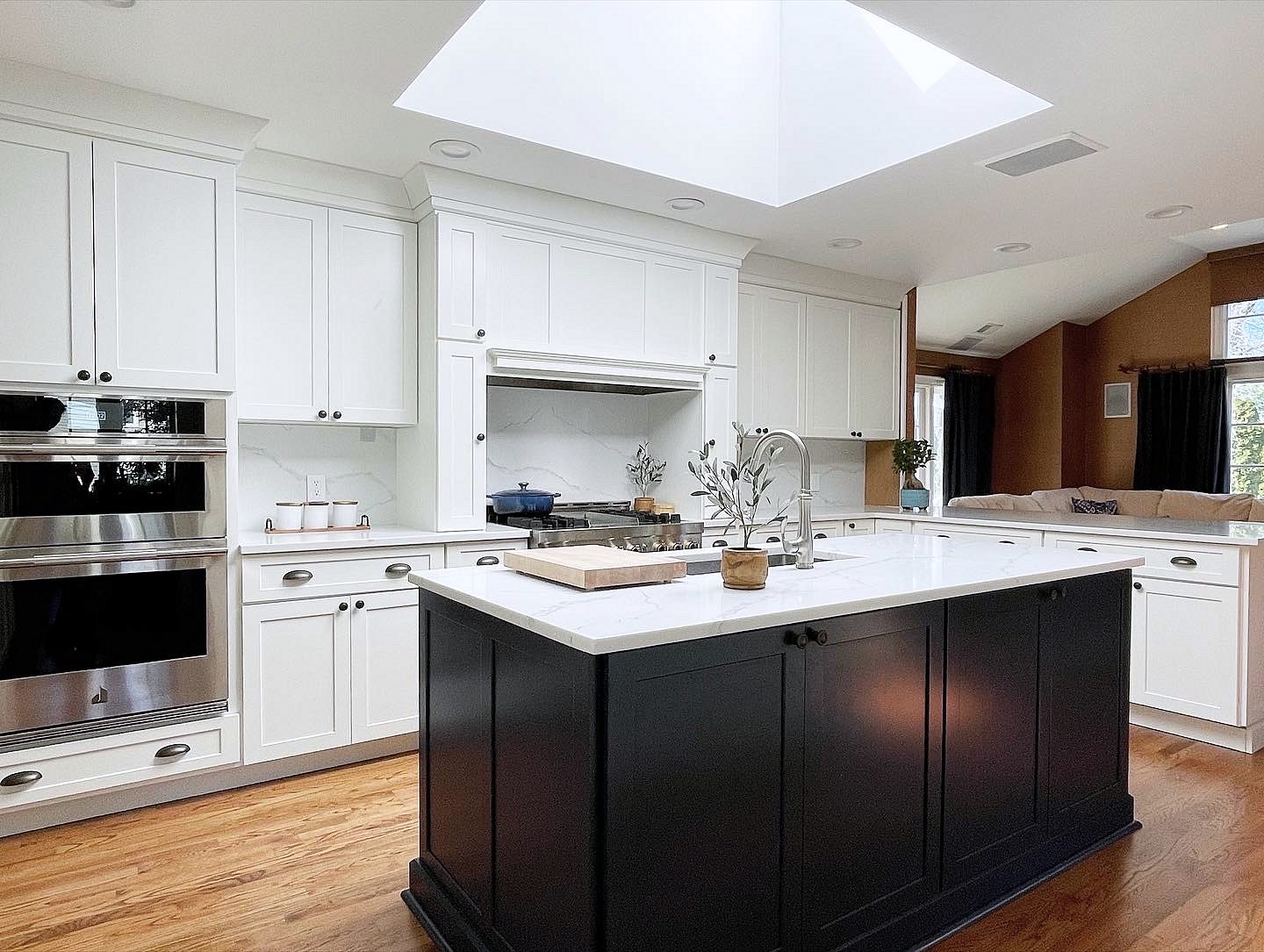 Shiloh Hanover kitchen in Aspen with a black island and a skylight