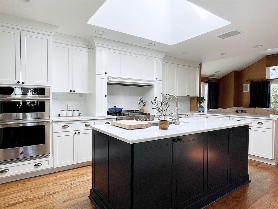 Shiloh Hanover kitchen in Aspen with a black island and a skylight