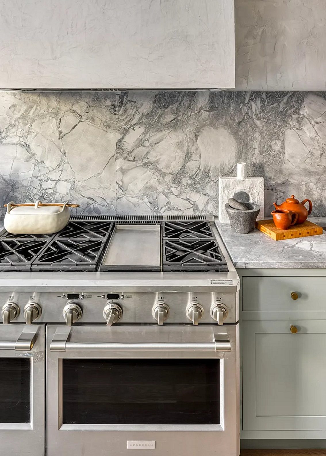 Built-in window seat — Shiloh Hanover inset in Mindful Gray with a marble slab backsplash