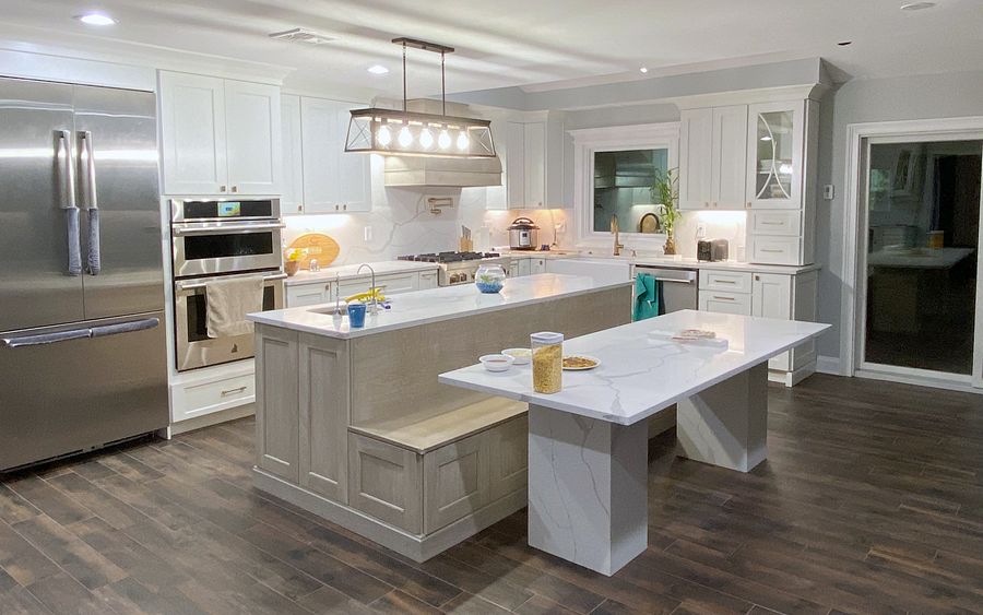Shiloh Heritage kitchen in Polar and Seagull with a bench island and a gray wood hood