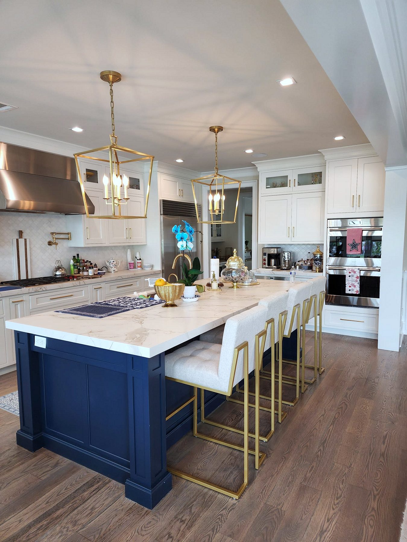 Shiloh inset kitchen with stacked white uppers and a navy island