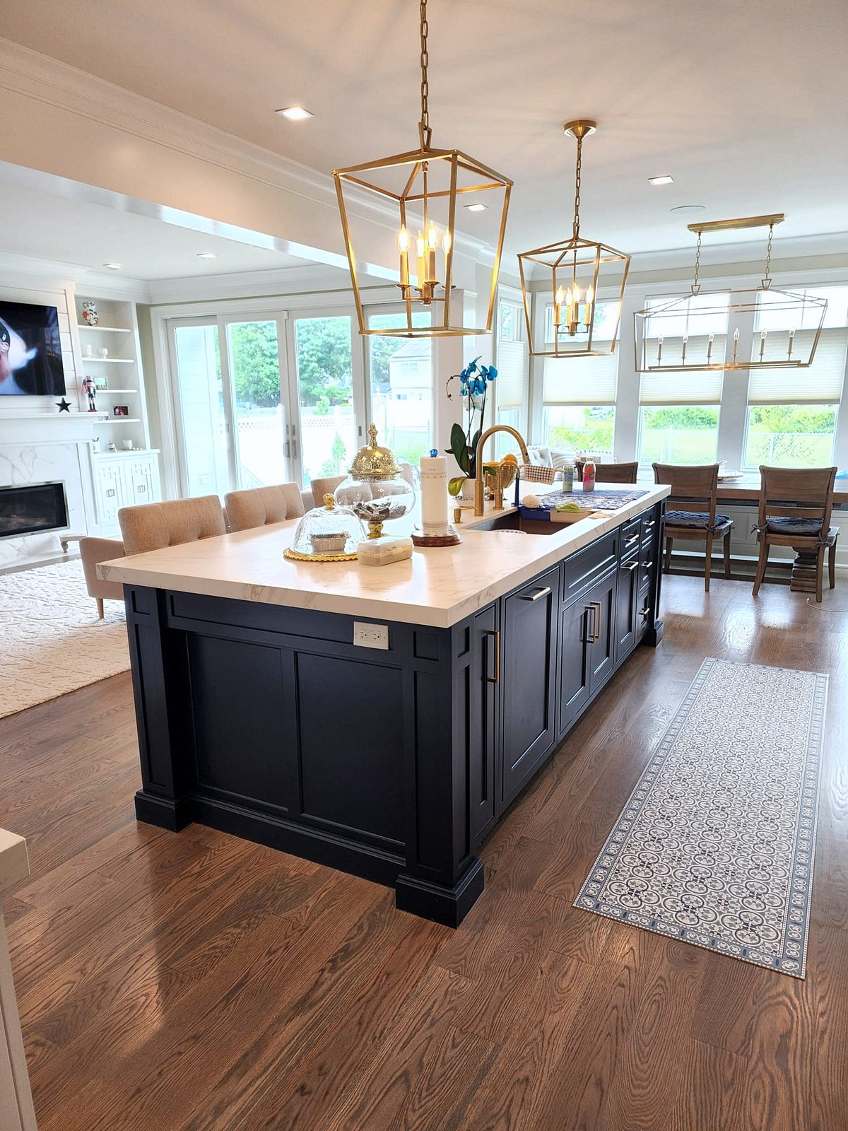 Shiloh inset door, white stacked uppers with a glass-front top row (archive label) — Shiloh inset kitchen with stacked white uppers and a navy island