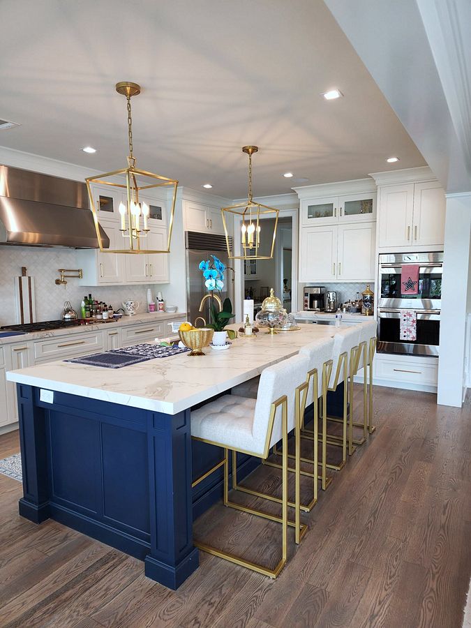 Shiloh inset kitchen with stacked white uppers and a navy island