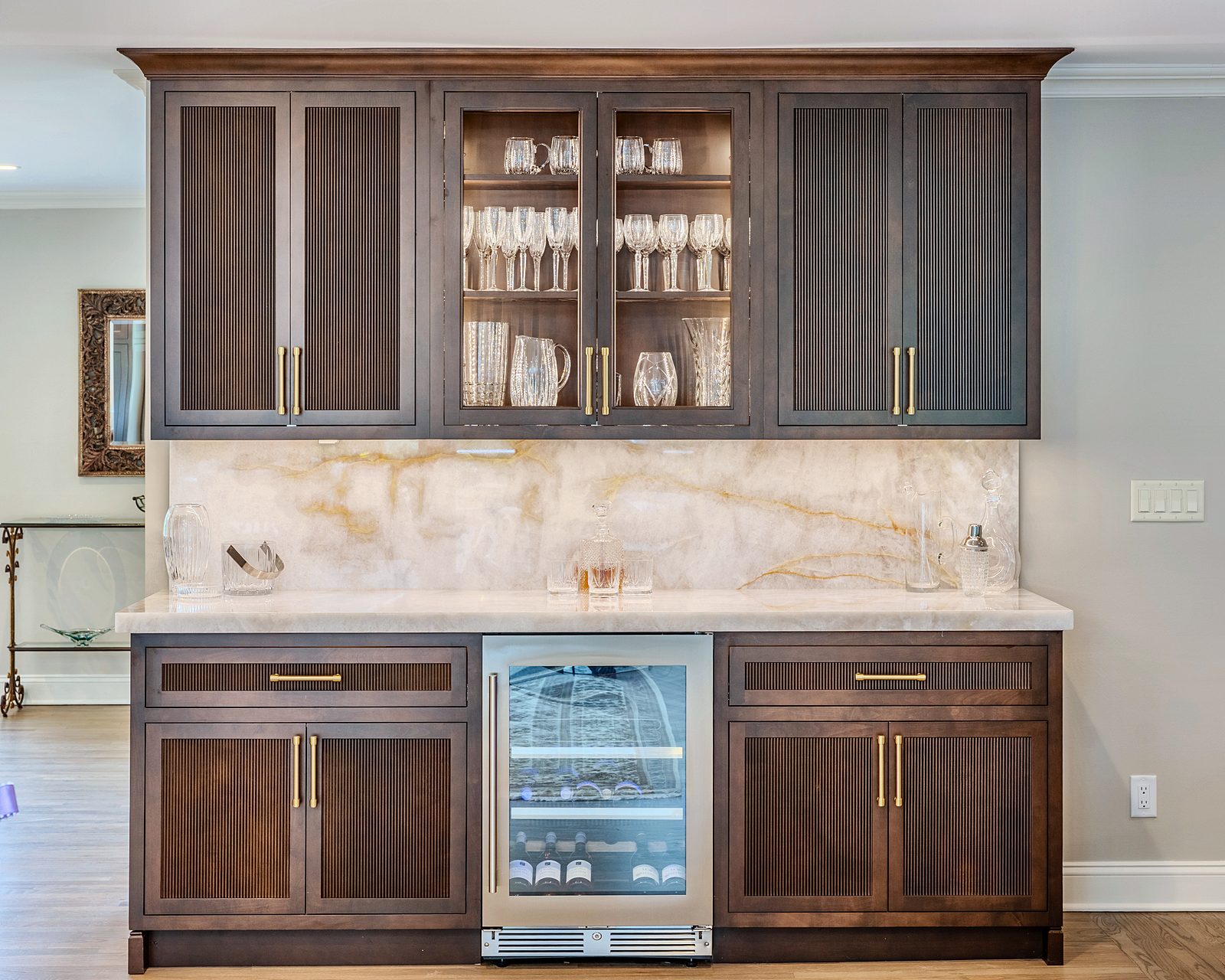 Sable-stained bar with glass uppers and wine refrigerator