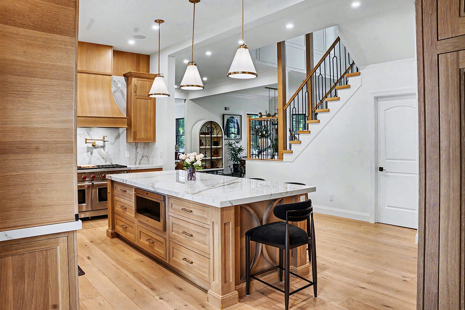 Oak kitchen opening to the stair hall