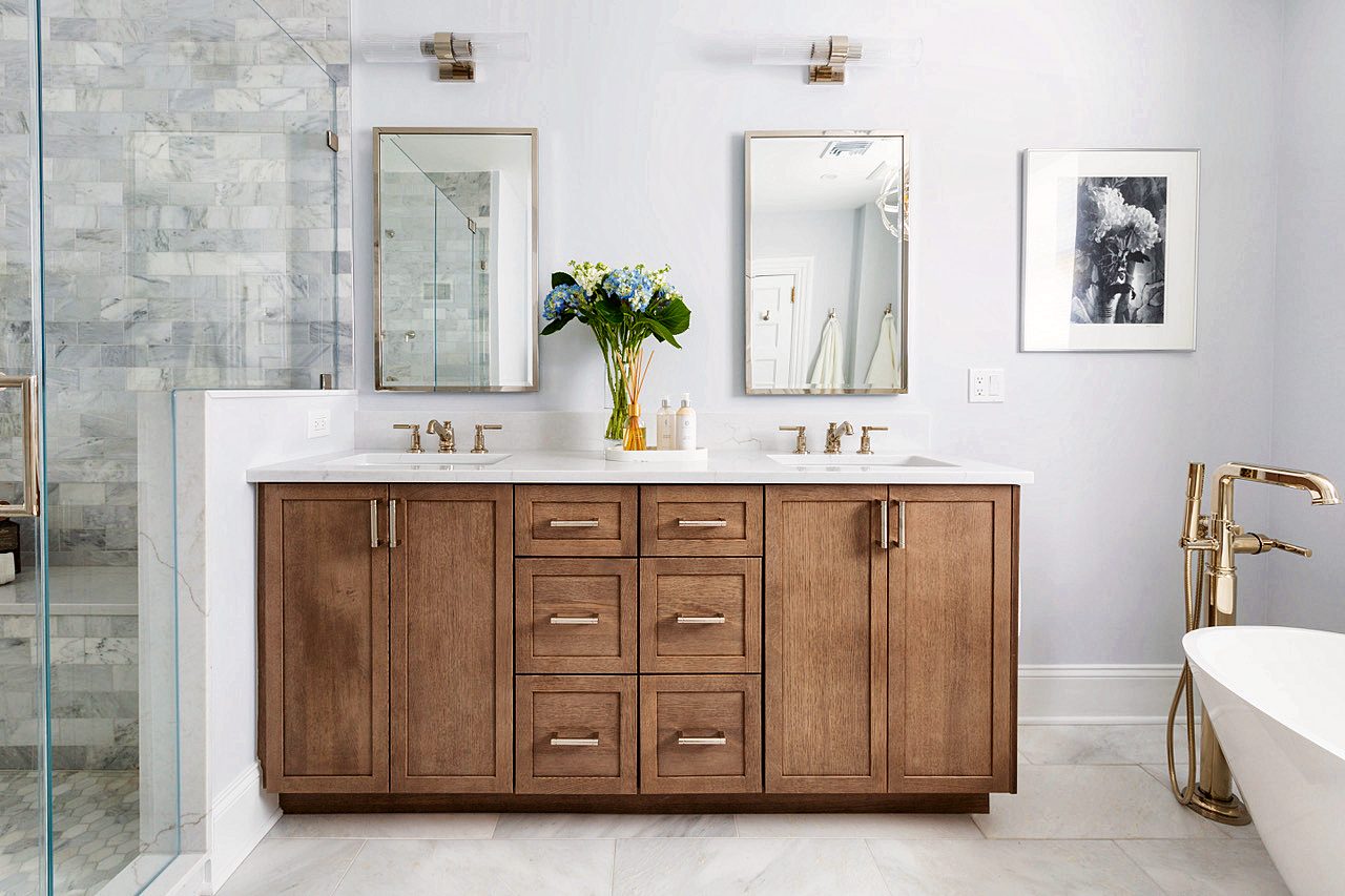Walnut double vanity with freestanding tub