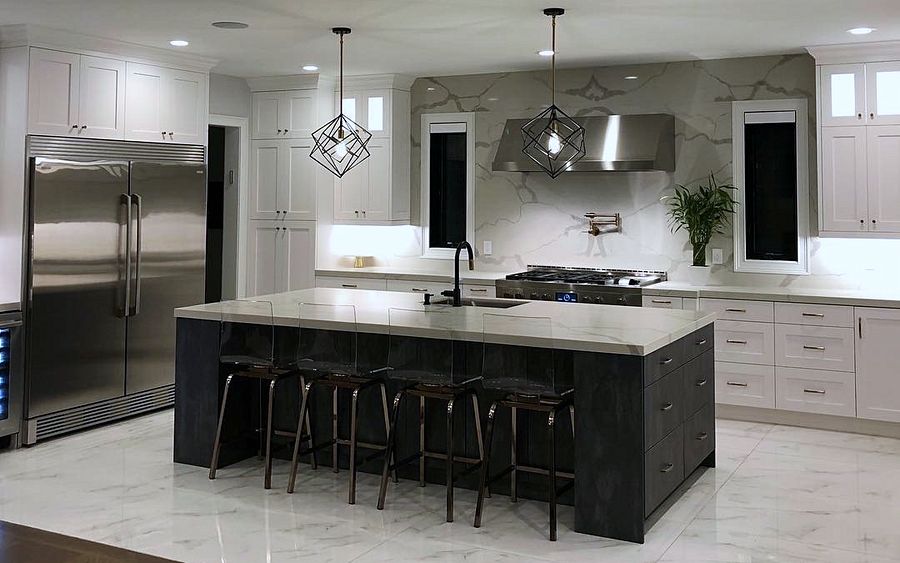 St. Martin white shaker kitchen with a black island and a marble-look slab backsplash