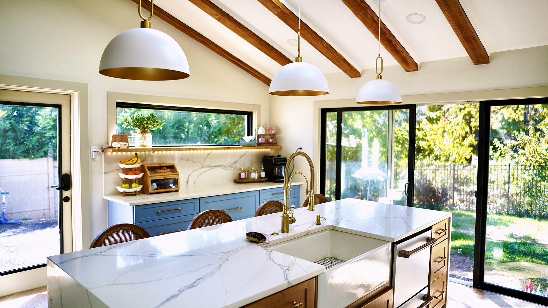 Ocean Blue kitchen with Timber island under a beamed ceiling