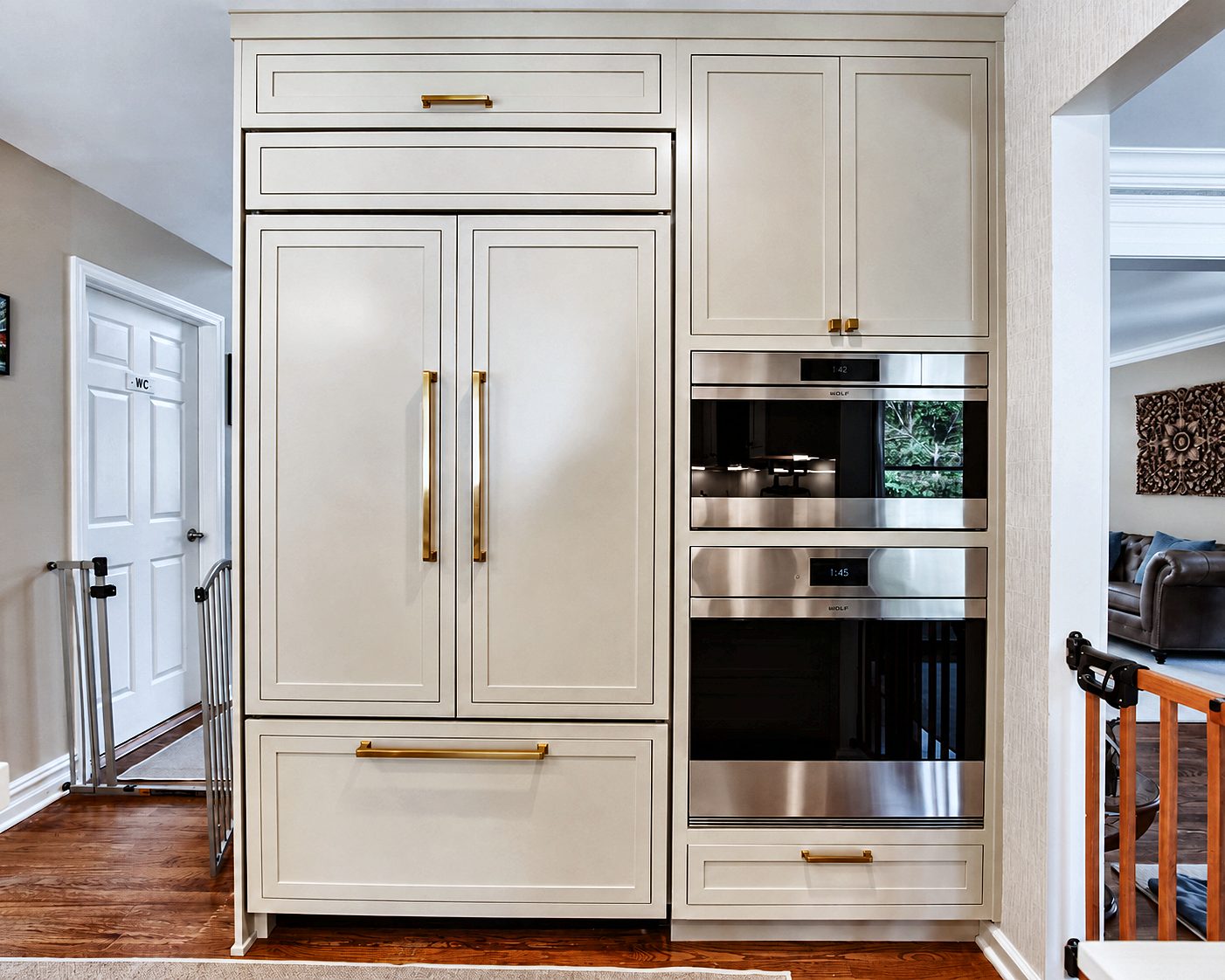 Integrated panel refrigerator and flush wall ovens