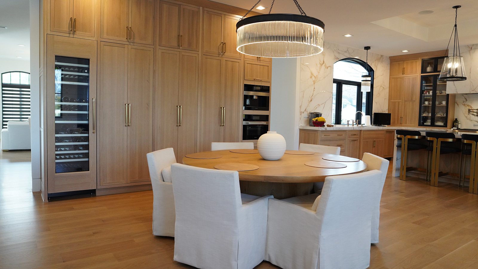 The kitchen with its wine column, tall oak run and round dining table