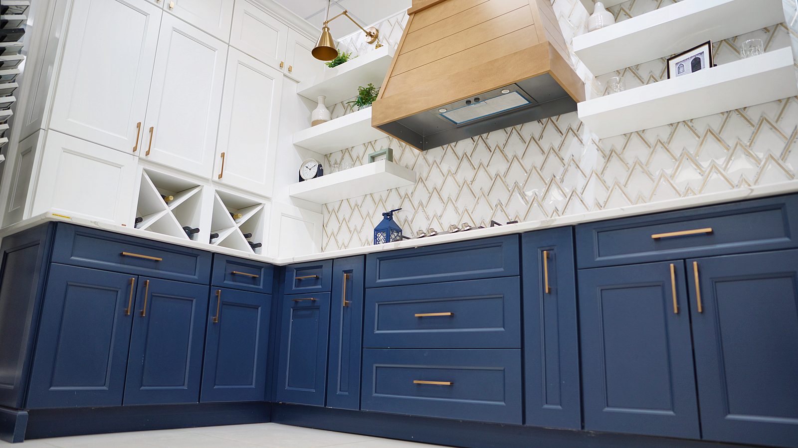 My House Kitchen Paramus showroom — Navy bases with brass pulls